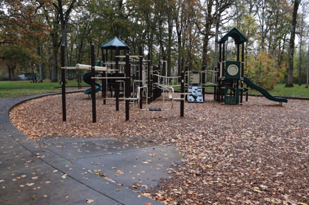 Large playground along paved trail – ramp into bark chip surface Large playground along paved trail – ramp into bark chip surface